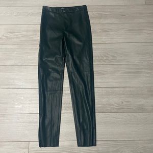 Dark green leather pants.